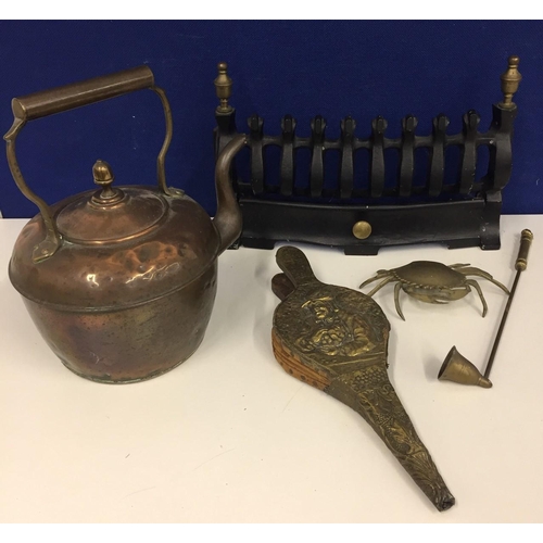 460 - A selection of fireside items. Includes front surround, brass bellows, copper kettle, brass candle s... 