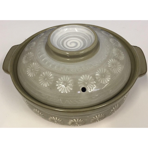 497E - A glazed, round Mishima lidded pot, with foral design to lid.