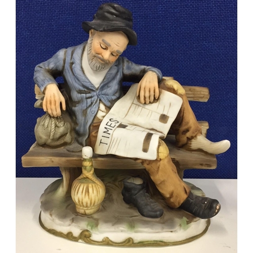 500 - A 'Marks and Rosenfeld' figurine of an old man on bench with The Times newspaper.