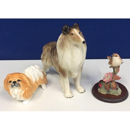 518 - A ceramic Collie dog figure, a 'Sylvac' Pekingese dog figure, together with a 'Border Fine Arts' Wre... 