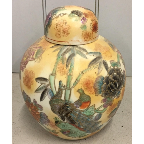 543 - An oriental ginger jar, decorated with peacock & flowers. Height 26cm.