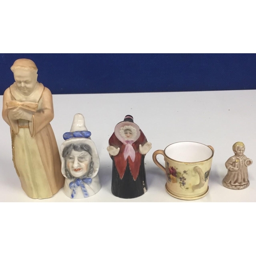 569 - A mixed lot of ceramic pieces. To include 'Royal Worcester' candle snuffers (Mrs Caudle, Granny & Mo... 