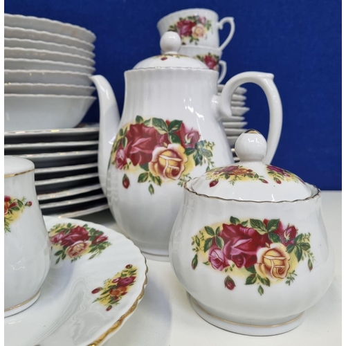 592 - A substantial 'Royal Norfolk' tea/dinner service, with an English 'Country Roses' design & golden ri... 