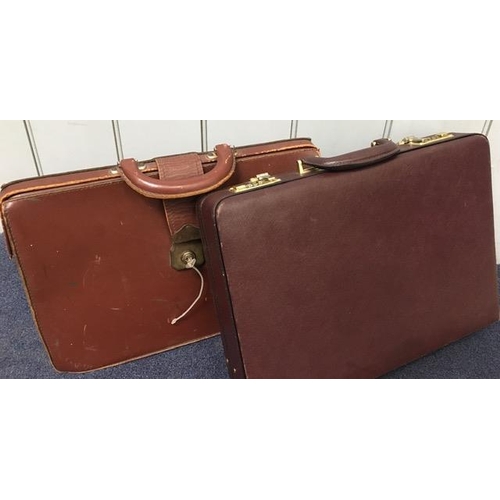 668A - A vintage, leather briefcase, together with a vintage, soft leather document case (with key).