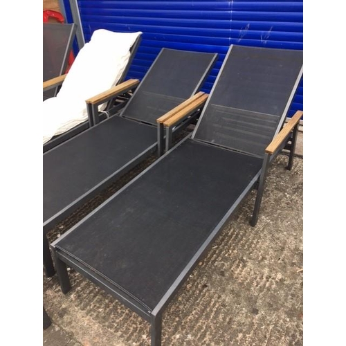 713F - A set of four, high-quality, stacking sunloungers, by 'Gloster'. Complete with full length lounger c... 