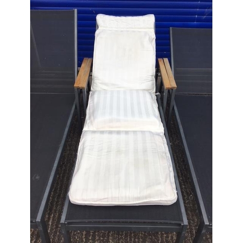 713F - A set of four, high-quality, stacking sunloungers, by 'Gloster'. Complete with full length lounger c... 