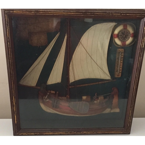 755 - A glass-cased, 3D diorama sailboat. Includes compass & a thermometer, with maps. Lighting requires r... 