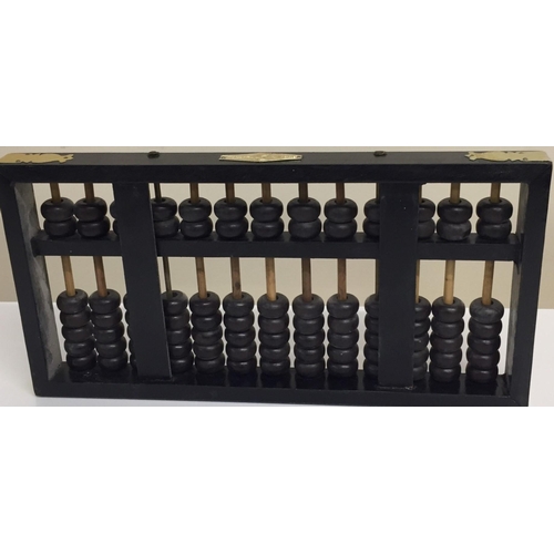 636 - A wooden-framed Chinese flying eagle abacus. 18cm x 35cm.