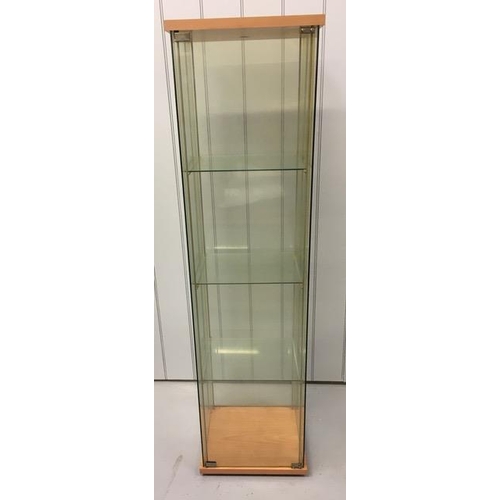 86 - An 'Ikea Detolf' glazed/beech coloured display cabinet. Dimensions(cm) H164, W43, D37.