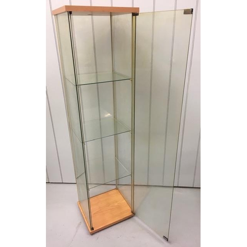 86 - An 'Ikea Detolf' glazed/beech coloured display cabinet. Dimensions(cm) H164, W43, D37.