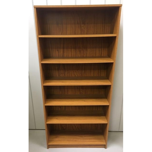 87 - Two contemporary bookcases. Oak coloured, with five shelves & beech coloured, with four shelves. Dim... 