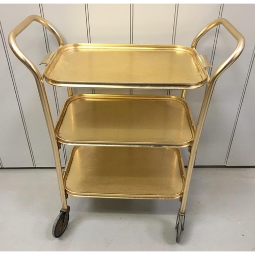 127 - A vintage, gold-coloured tea trolley, with three shelves. Dimensions(cm) H74, W63, D31.