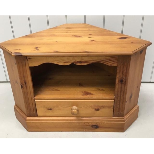 134 - A pine, corner TV stand, with single media drawer. Dimensions(cm) H62, W94, D53.