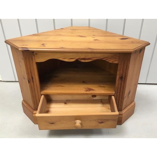 134 - A pine, corner TV stand, with single media drawer. Dimensions(cm) H62, W94, D53.