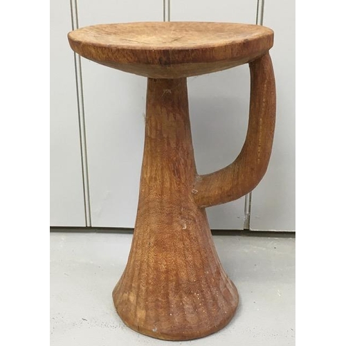 166 - A hand-carved 'Trumpet' stool. Dimensions(cm) H42, W27, D27.