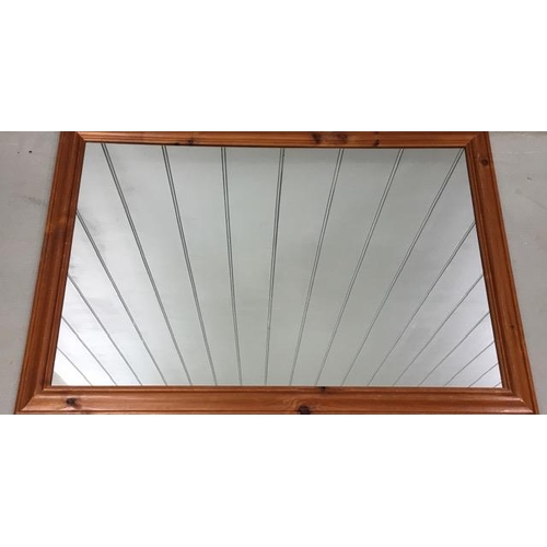 176 - A pine-framed, contemporary mirror. Dimensions(cm) H73, W103.