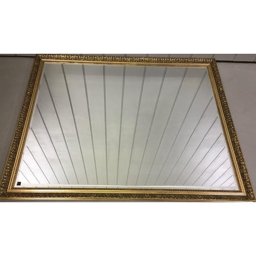 179 - A large, contemporary, bevelled-edged overmantle mirror, with a patterned gilt frame. Dimensions(cm)... 