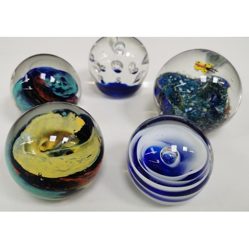 215 - A large collection of thirty-three good quality glass paperweights. To include a variety of patterns... 