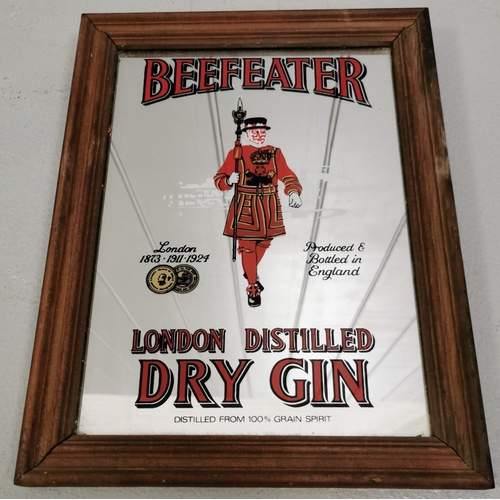 254 - A vintage advertising mirror - 'Beefeater Dry Gin'. 34cm x 26cm.