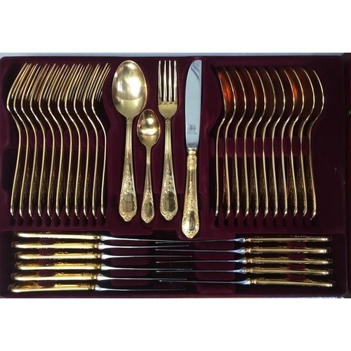 426 - A cased, 24ct gold-plated, twelve-place canteen of cutlery, by 'Solingen'. Sixty-nine pieces in tota... 