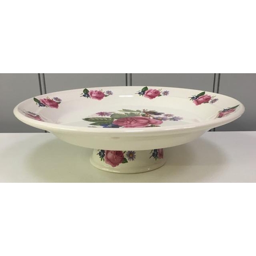 513 - A raised cake stand, with rose petal design, by 'Portmeirion'.