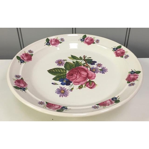 513 - A raised cake stand, with rose petal design, by 'Portmeirion'.