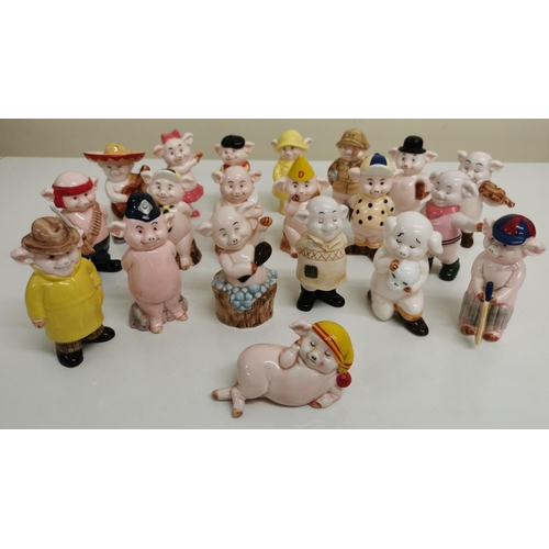 515 - A collection of twenty 'Piggies' ceramic figures.