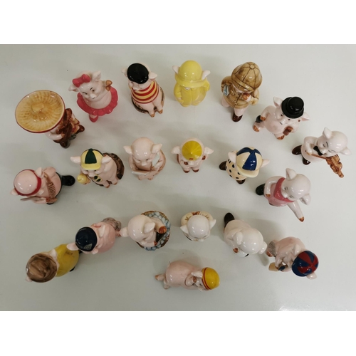 515 - A collection of twenty 'Piggies' ceramic figures.