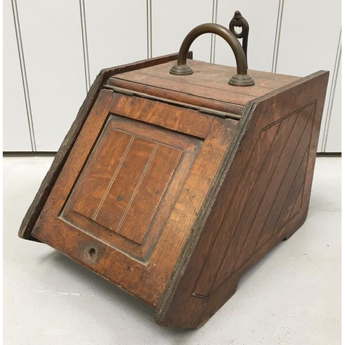 630 - A Victorian, oak & brass coal scuttle, with original pan. Dimensions(cm) H30, W32, D45.