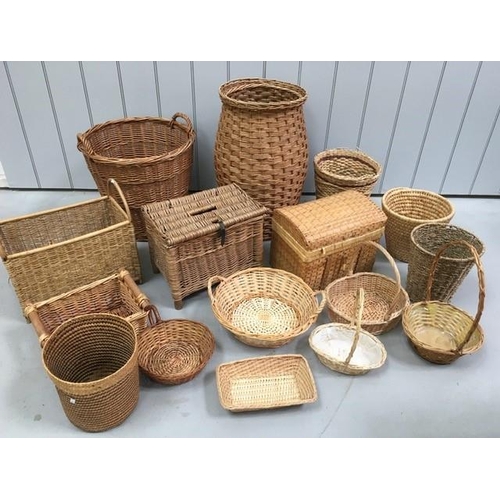 646 - A large collection of sixteen wicker items. To include washing basket, coal basket, hampers, sewing ... 