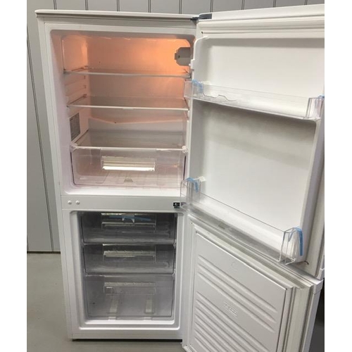 801 - A 50:50 fridge-freezer, by 'Essentials'. Model no. CE55CW18. Complete with salad crisper, all shelve... 