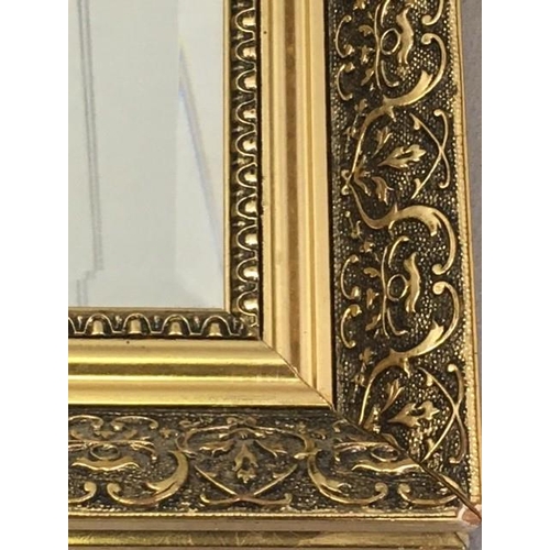 179 - A large, contemporary, bevelled-edged overmantle mirror, with a patterned gilt frame. Dimensions(cm)... 