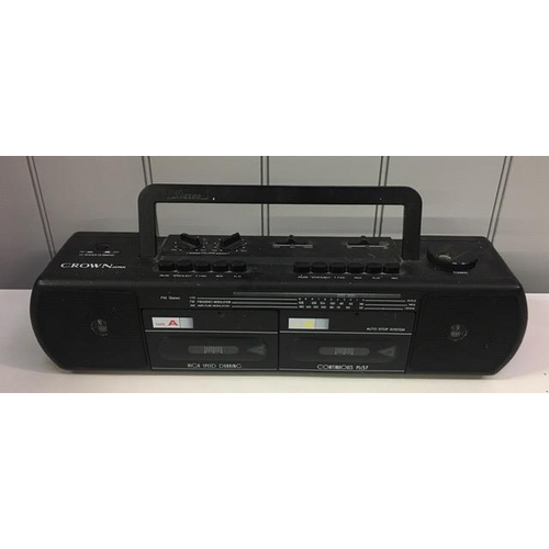 806 - A portable twin-cassette/radio player, by 'Crown'. Model no. PSK150. PAT Test pass & functionality t... 