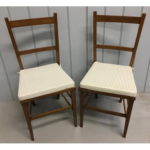 142 - A pair of Edwardian, mahogany inlaid side chairs, with bergere seats. Complete with later/removable ... 