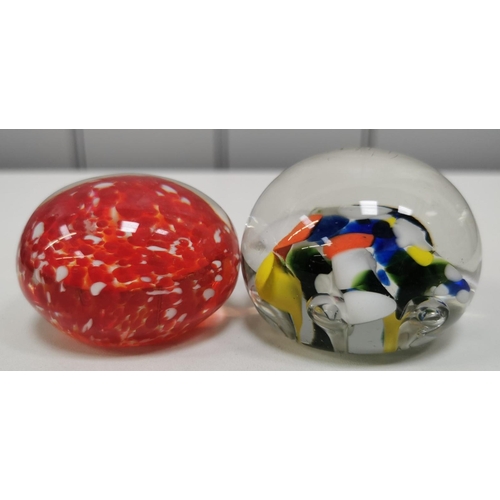 209 - A collection of twelve good quality glass paperweights, with a variety of patterns.