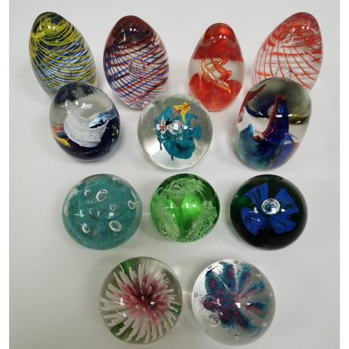 210 - A collection of twelve good quality glass paperweights, with a variety of patterns.