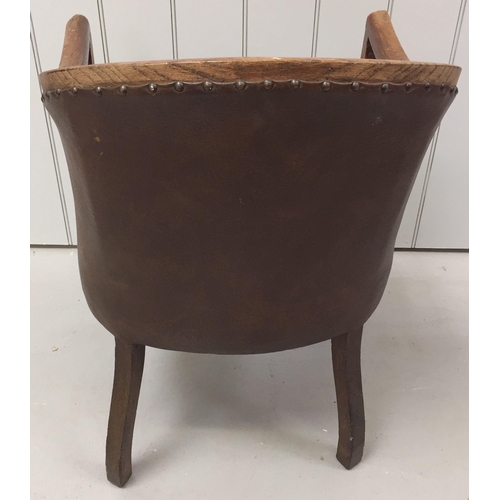 145C - An Edwardian, oak-framed/leather upholstered tub-style chair. Dimensions(cm) H85(47 to seat), W56, D... 