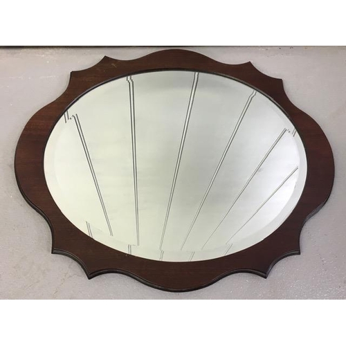 178 - A scalloped-shaped, bevelled-edged mirror. Dimensions(cm) H49, W60.