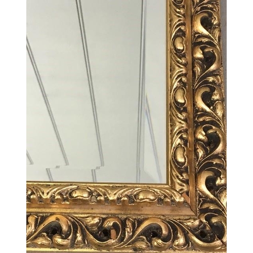 180 - A large, contemporary, bevelled-edged overmantle mirror, with a patterned gilt frame. Dimensions(cm)... 