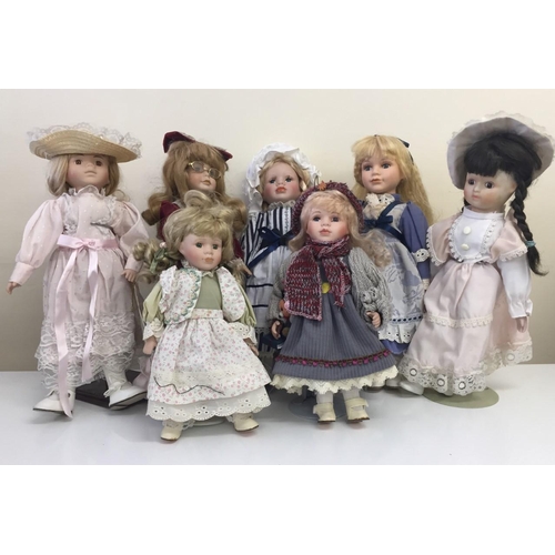 4188 - A collection of ten porcelain dolls, seven with stands.