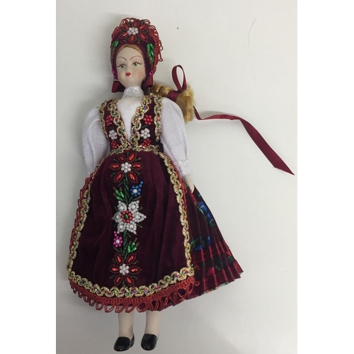 4190 - A collection of eleven souvenir/national costume dolls.