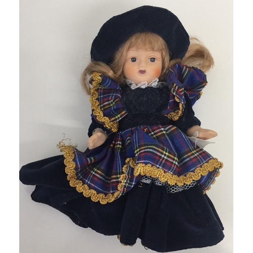 4190 - A collection of eleven souvenir/national costume dolls.