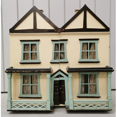 A stunning, handmade dolls house c.1950's. Fully furnished with mid-century styling. Includes a large quantity of miniature accessories e.g., tableware, telephone etc. Dimensions(cm) H77, W70, D37.