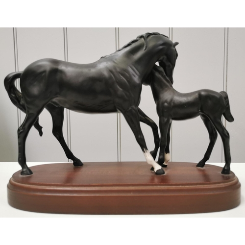 A boxed 'Royal Doulton - Black Beauty with foal' figurine
