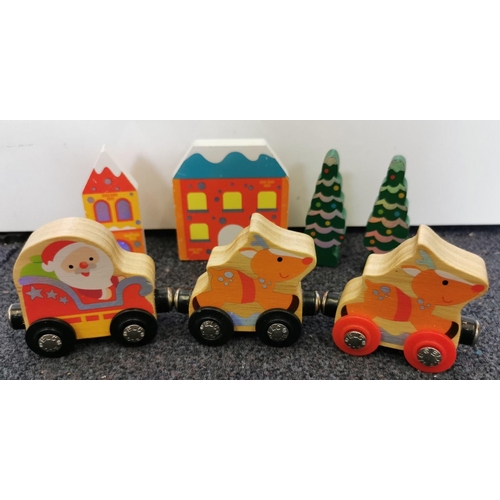 2703 - A mixed lot of children's wooden train playset pieces & accessories.