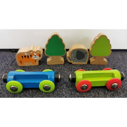 2703 - A mixed lot of children's wooden train playset pieces & accessories.