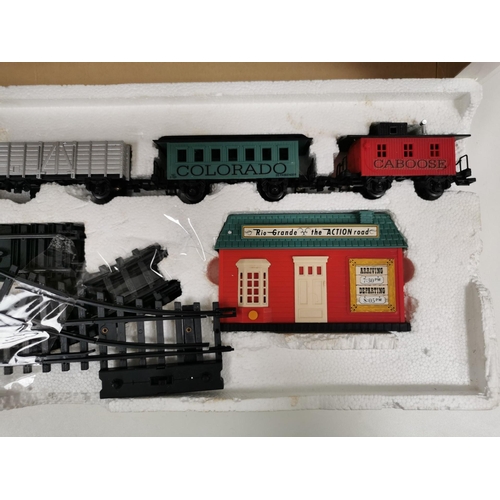 2704 - A boxed, battery powered, 'New Bright' Rio Grande train set. To include engine, three carriages, sta... 