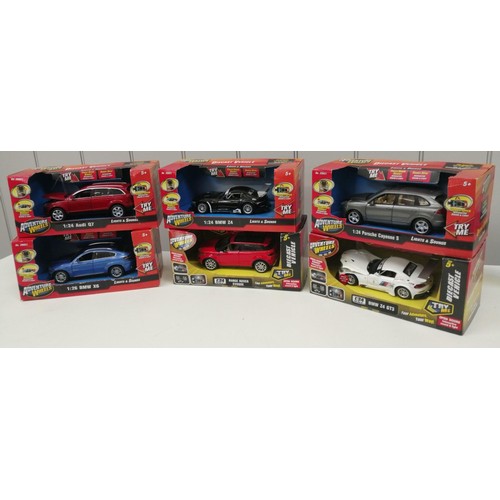 2179 - A collection of six boxed, 1;24 scale, diecast 'Adventure Wheels' model cars, with lights & sound ef... 