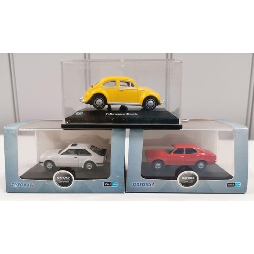 2381 - A collection of Oxford Diecast models. To include a boxed IMR Locomotive, a cased Mini Cooper rally ... 