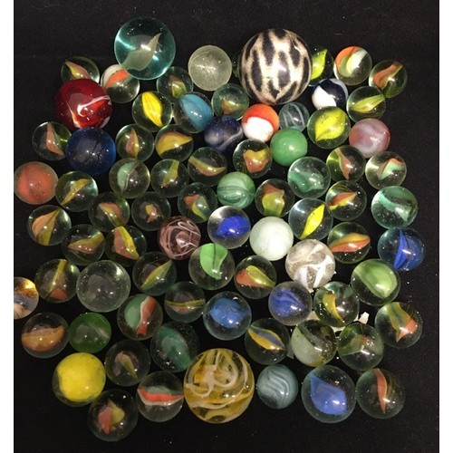 1964 - A jar of early 20th century marbles.